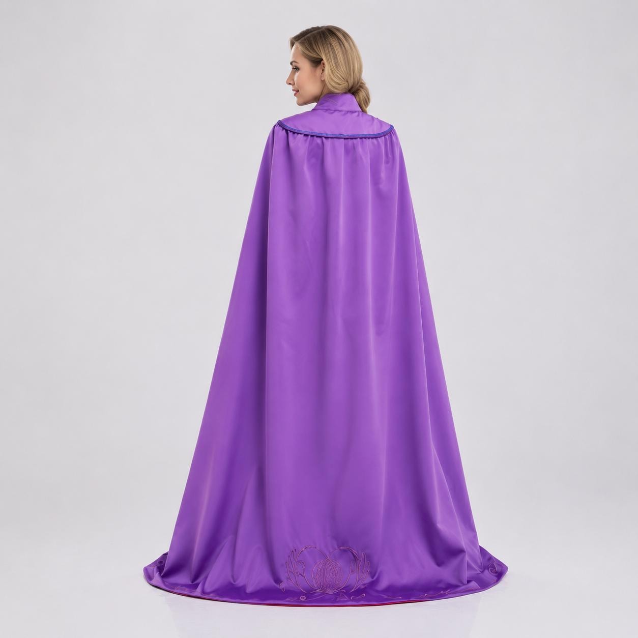 May include: A floor-length purple cape featuring a smooth, satin-like finish. The garment includes a rounded collar with a decorative trim along the neckline and a subtle, embossed floral pattern visible near the bottom hem of the fabric.