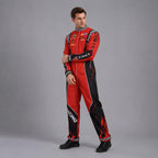 May include: A red and black racing jumpsuit featuring a high collar with a black and white checkered pattern, long sleeves with sponsor patches, and the word RACING printed vertically in white on the right leg with red flame graphics.
