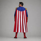 May include: A costume featuring a long cape with vertical red and white stripes and a blue upper section adorned with white stars. The outfit includes blue sleeves, gold shoulder epaulets, and red gloves paired with matching red boots.