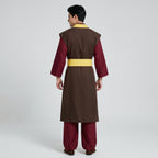 May include: A long-sleeved brown tunic with a yellow collar and waist sash, worn over dark red trousers. The garment features a structured brown vest layer over the sleeves, creating a layered appearance with a solid color palette.