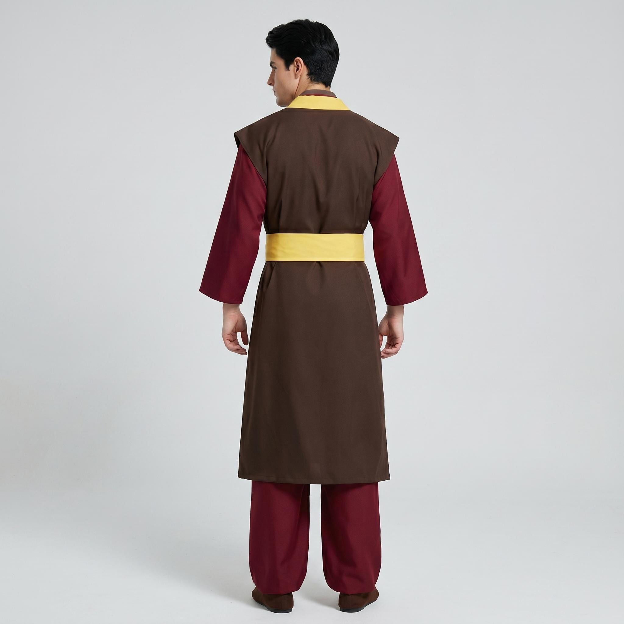May include: A long-sleeved brown tunic with a yellow collar and waist sash, worn over dark red trousers. The garment features a structured brown vest layer over the sleeves, creating a layered appearance with a solid color palette.