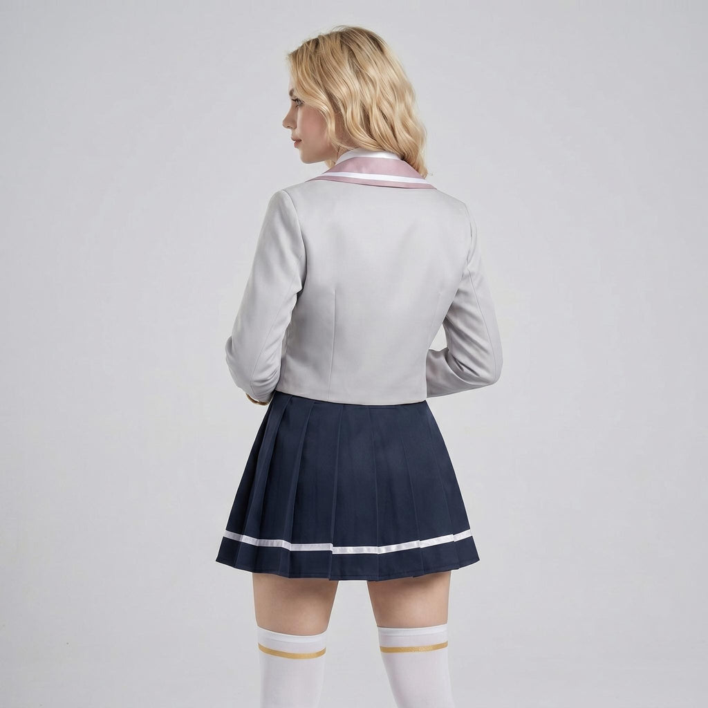 May include: A light gray long-sleeved blazer with a pink collar and a dark navy blue pleated skirt featuring a thin white horizontal stripe near the hem, paired with white knee-high socks that have a thin gold band at the top edge.