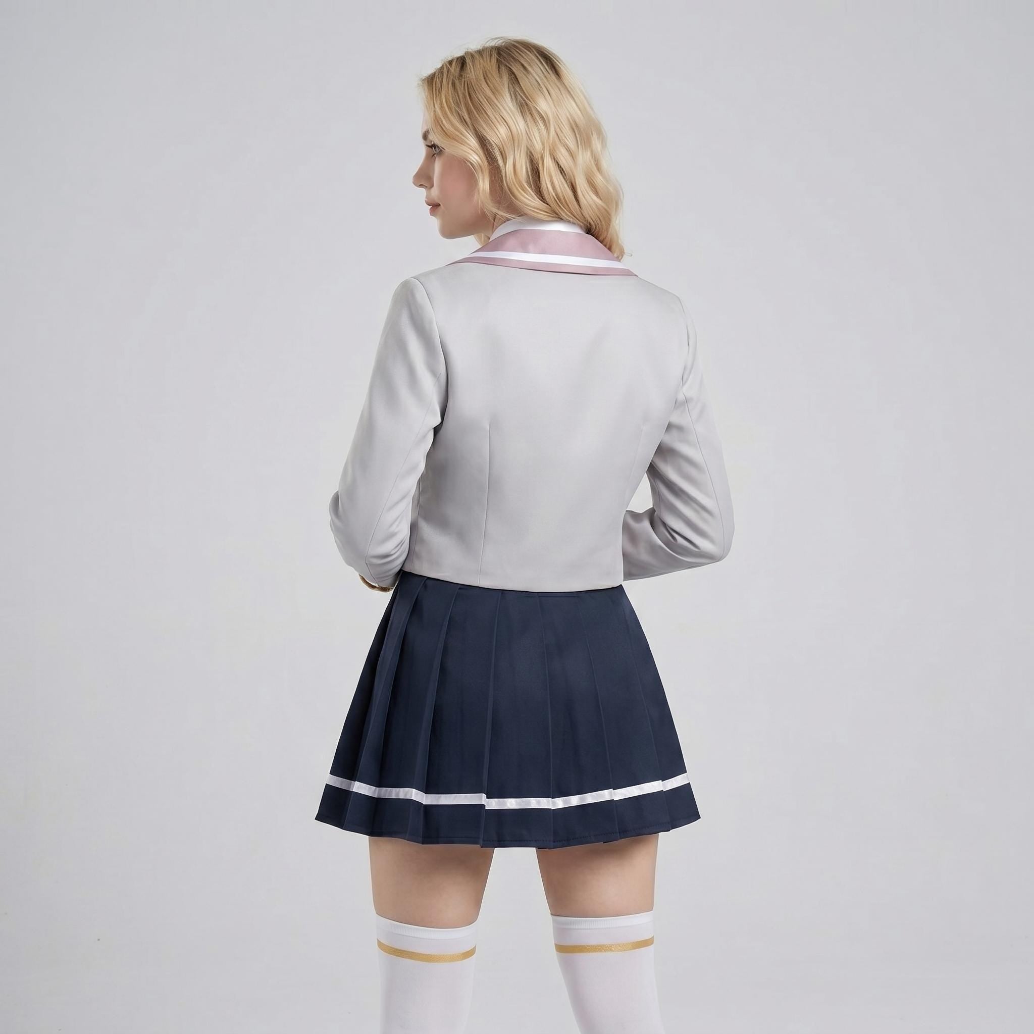 May include: A light gray long-sleeved blazer with a pink collar and a dark navy blue pleated skirt featuring a thin white horizontal stripe near the hem, paired with white knee-high socks that have a thin gold band at the top edge.