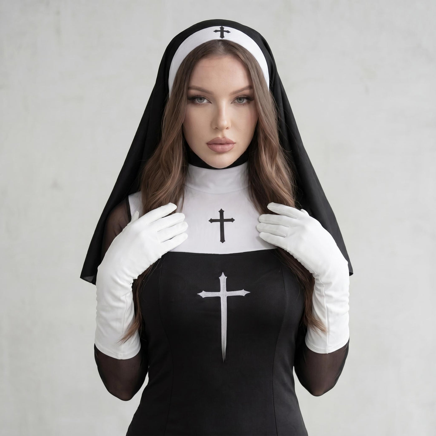 May include: A black and white nun costume featuring a black dress with a white collar and a cross emblem. The costume includes a white headpiece with a cross and white gloves. The nun's habit is black.