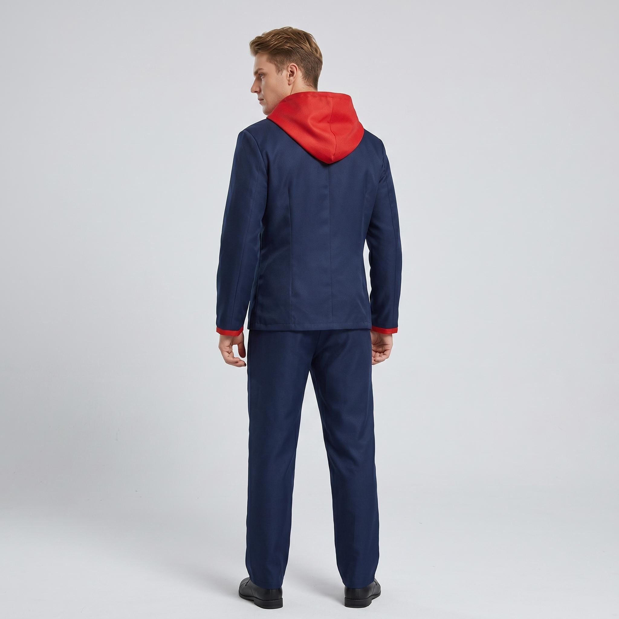 May include: A dark blue suit consisting of a blazer and trousers, featuring a bright red hood attached to the collar and red trim on the sleeve cuffs. The blazer has a structured back, and the trousers are straight-legged and matching in color.