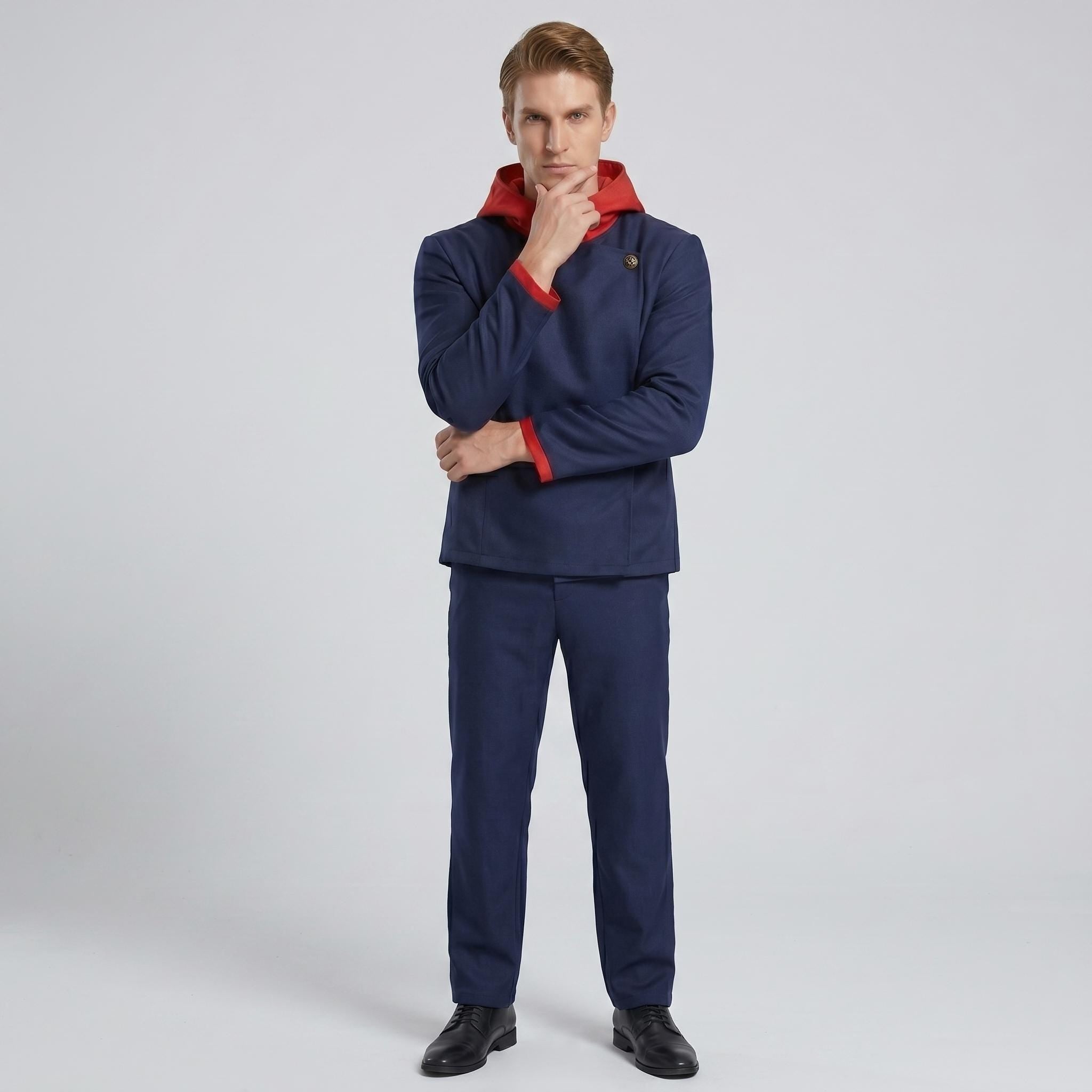 May include: A dark blue jacket with a red hood and red sleeve cuffs, paired with matching dark blue trousers. The jacket features a single visible button closure at the collar and a structured fit. The ensemble is completed with black dress shoes.
