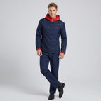 May include: A dark blue jacket with a red hood and red sleeve cuffs, featuring a high collar with a single gold button closure, paired with matching dark blue trousers and black shoes. The jacket has a diagonal front closure design.