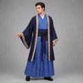 May include: A layered ensemble featuring a bright blue inner robe with a V-neckline, paired with a dark navy blue outer coat with wide sleeves. The coat is trimmed with a tan patterned border. A dark navy blue sash is tied at the waist over a pleated skirt.