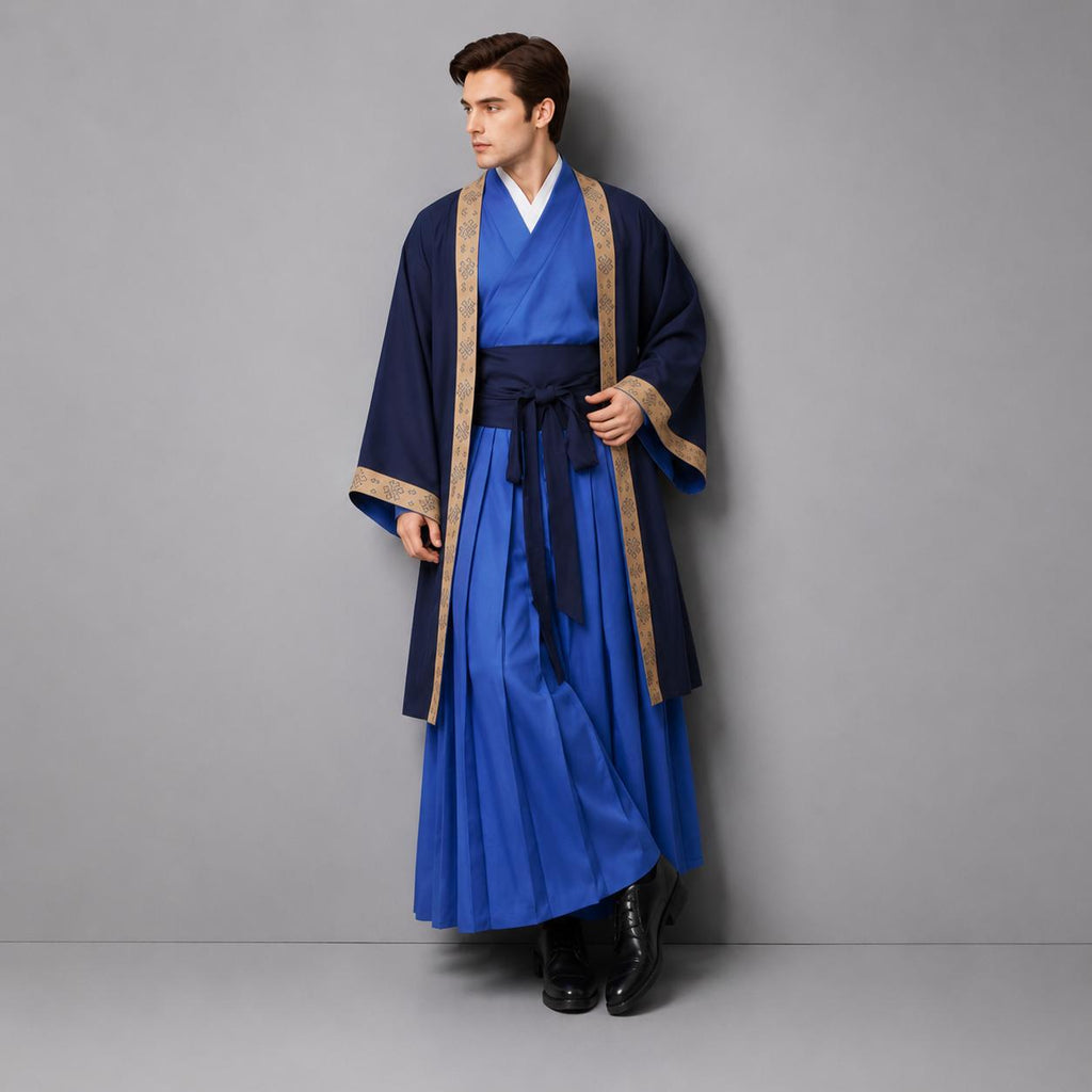 May include: A long-sleeved navy blue outer robe with a tan patterned trim worn over a bright blue wrap-style top and a matching pleated skirt. The ensemble features a dark blue sash tied at the waist, creating a layered look with distinct blue tones.