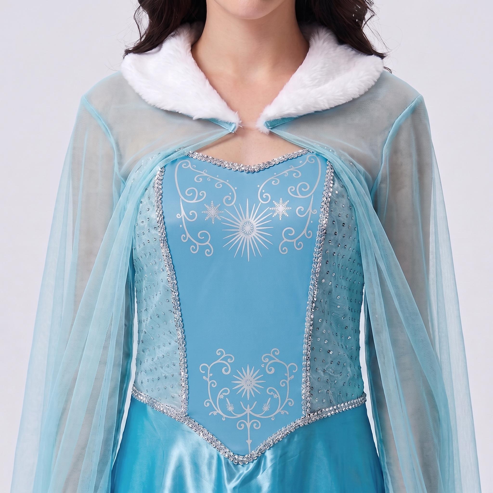 May include: A light blue dress featuring a white faux fur collar and long sheer sleeves. The bodice has a central panel with silver star and scroll patterns, bordered by silver sequin trim, and side panels with a subtle textured dot design.