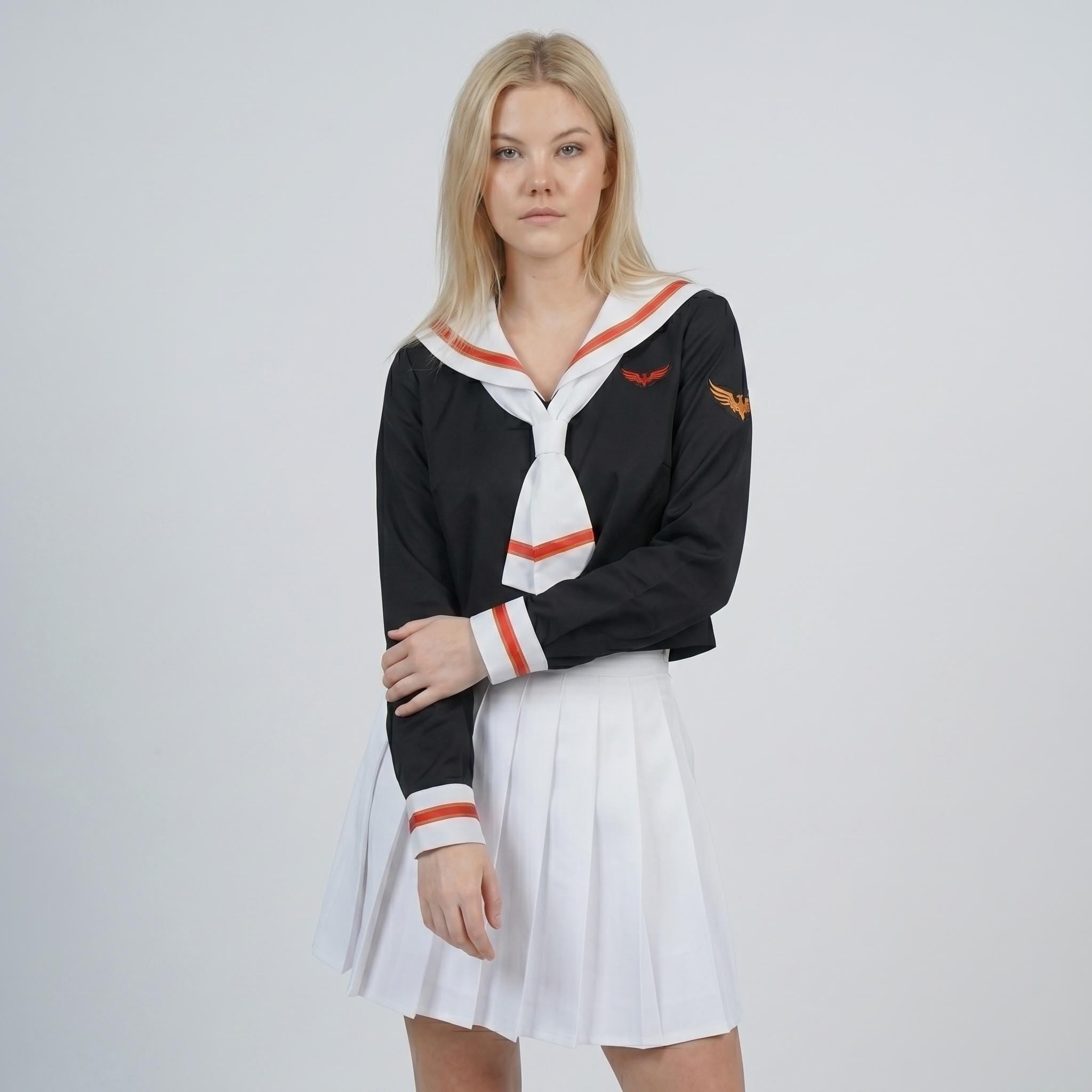 May include: A black long-sleeved top with a white sailor-style collar featuring orange trim, a matching white necktie, and orange sleeve cuffs. The top includes an orange wing emblem on the chest and shoulder. A white pleated skirt completes the outfit.