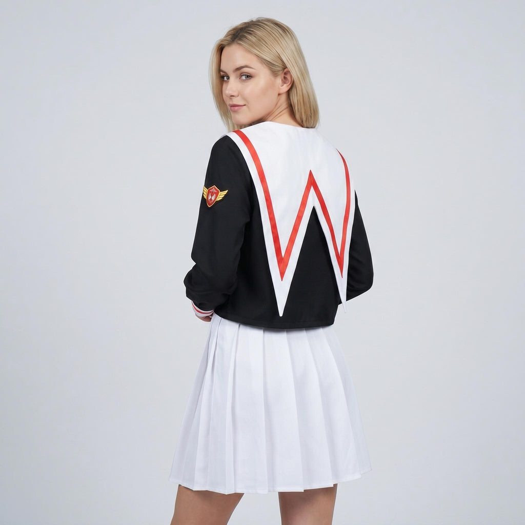 May include: A black long-sleeved top with a large white sailor collar featuring red trim, paired with a white pleated skirt. The top has a gold and red emblem on the right sleeve. The outfit is shown from the back, highlighting the collar design.