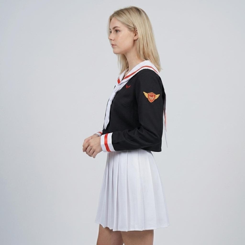 May include: A black long-sleeve top with a white sailor collar featuring red trim, a white necktie, and a gold winged emblem on the left sleeve, paired with a white pleated skirt. The top has red and white striped cuffs on the long sleeves.