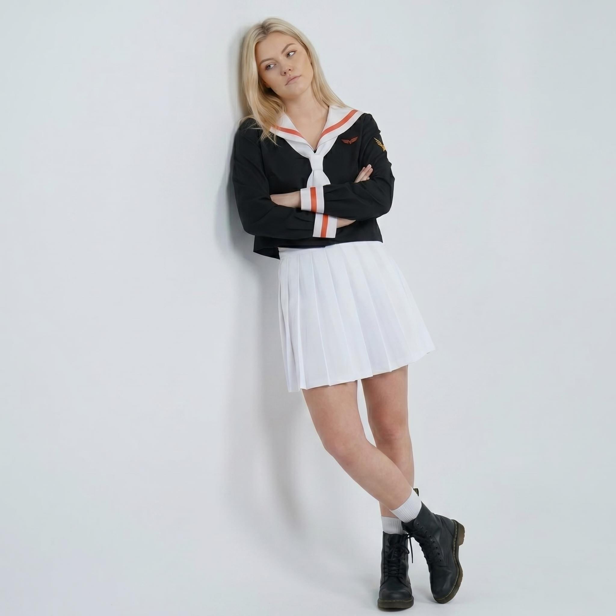 May include: A black long-sleeved top with a white sailor-style collar featuring orange stripes, paired with a white pleated mini skirt and black lace-up boots. The top includes a small embroidered emblem on the left sleeve and white cuffs with orange stripes.