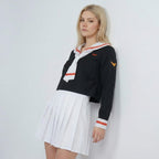 May include: A black long-sleeved sailor-style top featuring a white collar with orange stripes, a matching white necktie, and orange wing-like emblems on the chest and sleeve, paired with a crisp white pleated mini skirt.