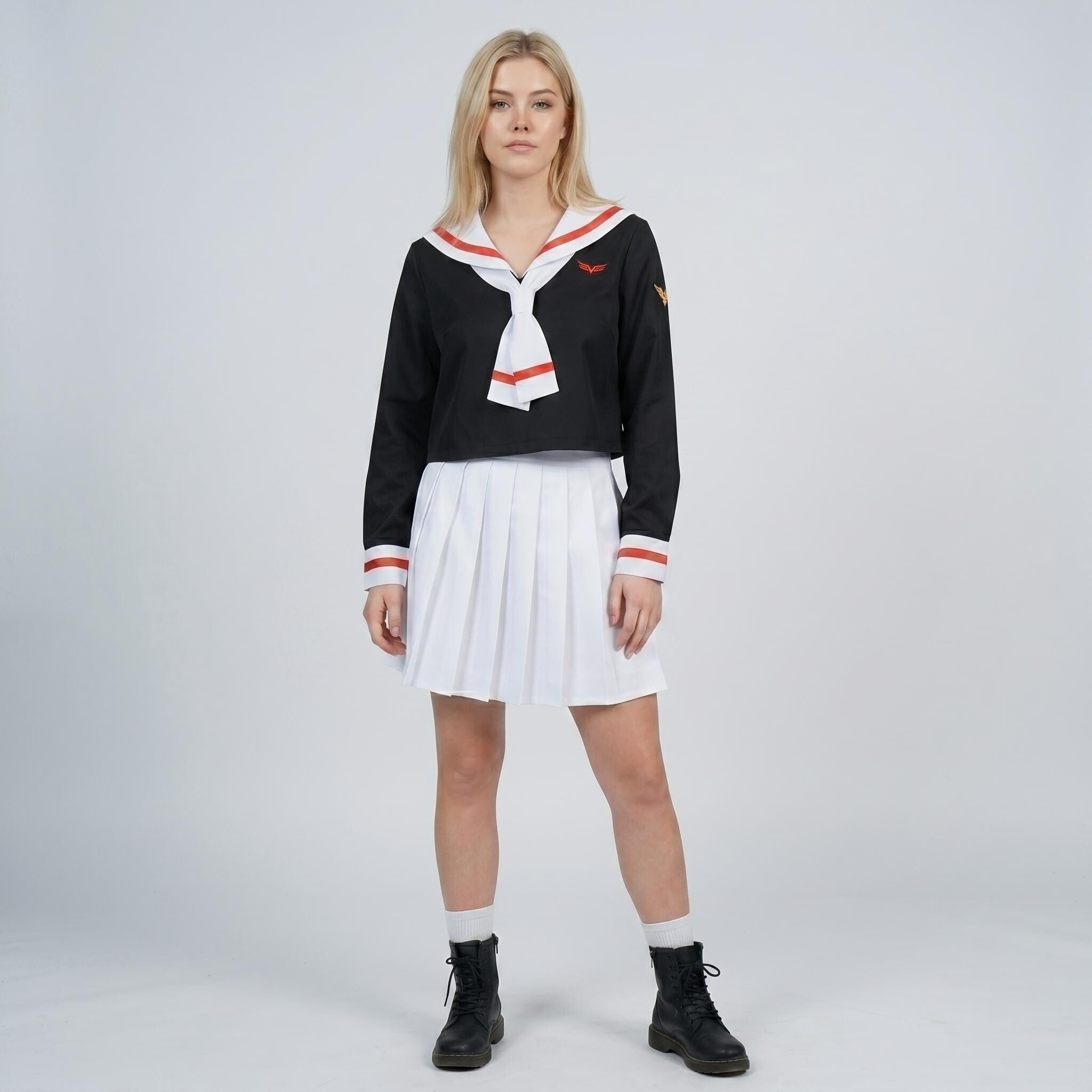 May include: A black long-sleeve top with a white sailor-style collar featuring red trim and a matching necktie. The top includes a small red emblem on the chest. Paired with a white pleated mini skirt and black lace-up boots for a complete outfit.