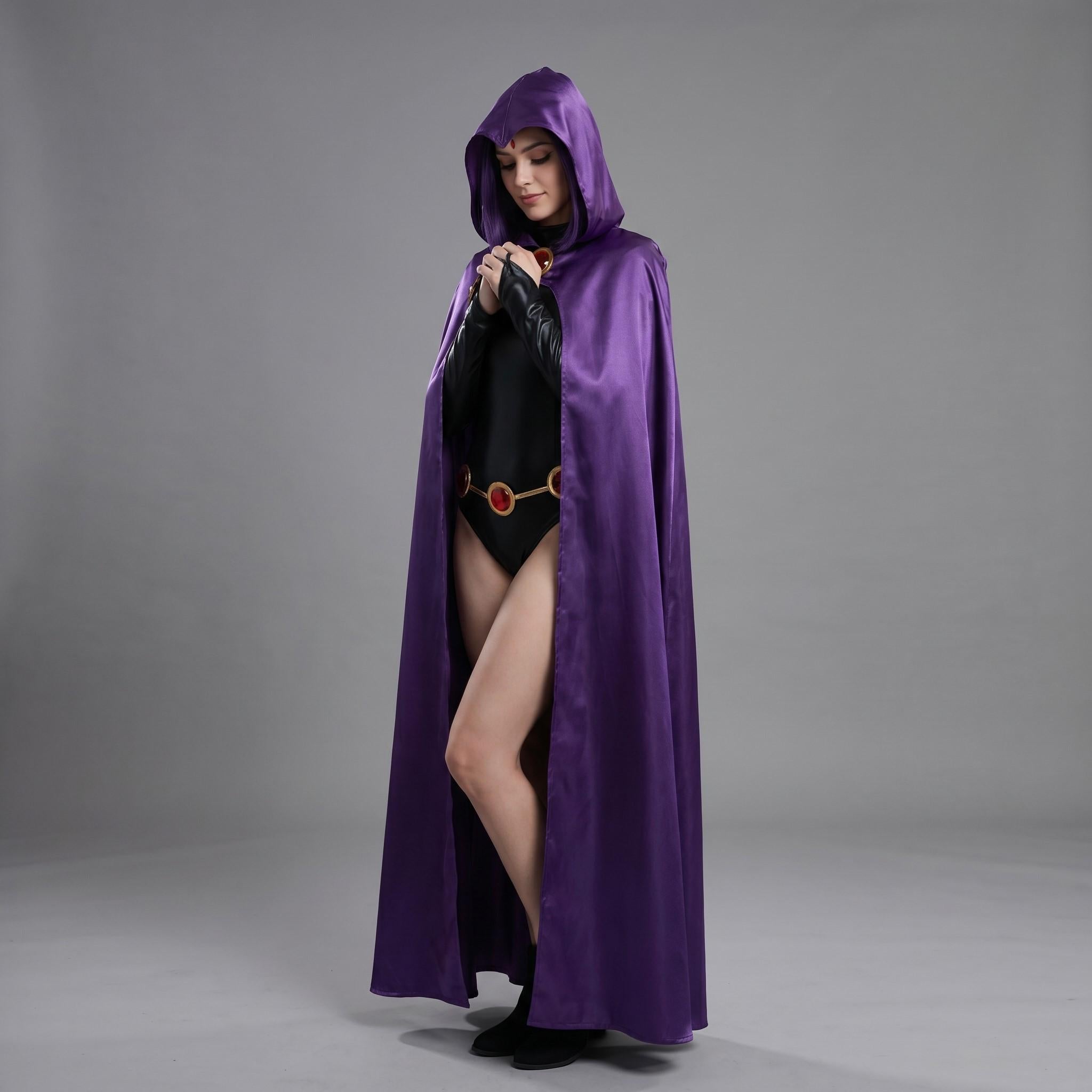 May include: A long, flowing purple hooded cape. The cape is made of a shiny, satin-like material. The person is wearing a black bodysuit with a gold belt with red accents. The hood is up, and the person is wearing black boots.