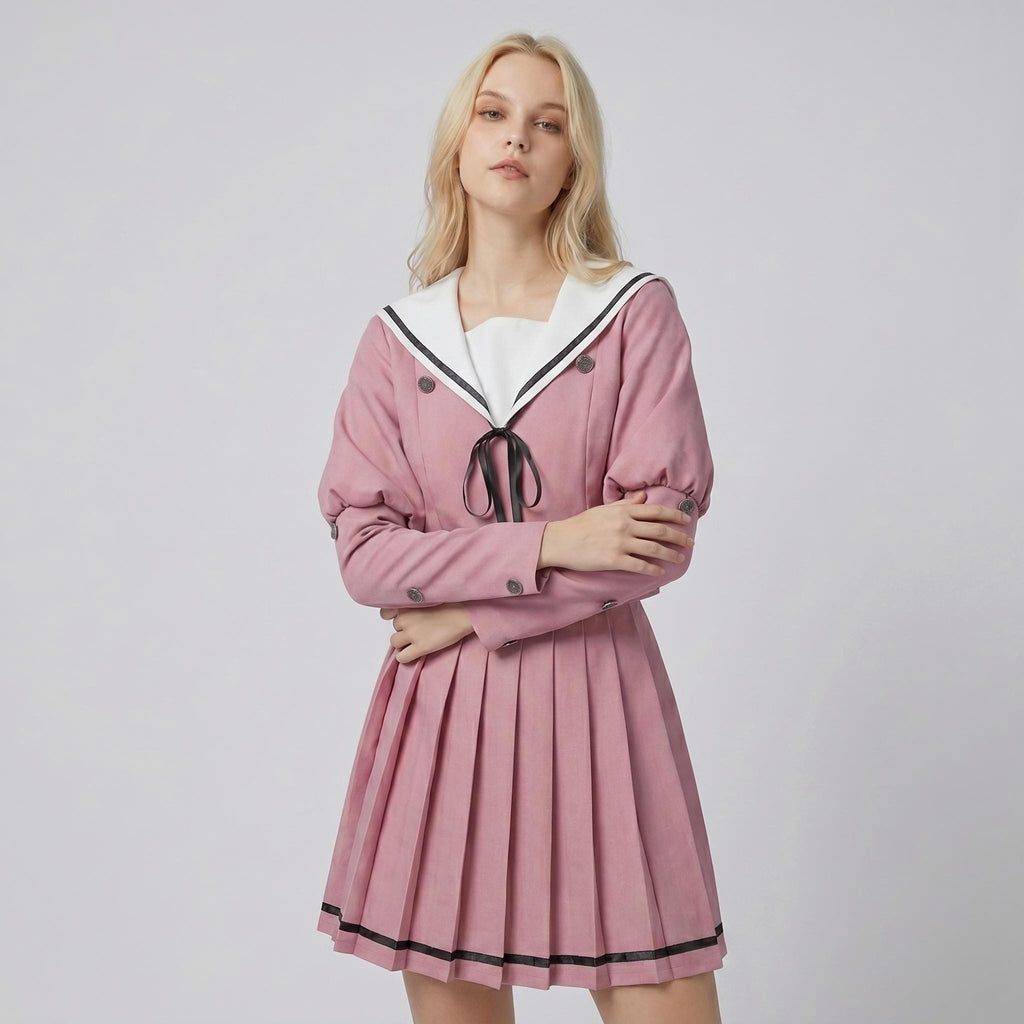 May include: A dusty pink long-sleeved dress featuring a white sailor-style collar with black trim, a black ribbon tie at the neckline, and a pleated skirt. The bodice includes double-breasted buttons and the sleeves have buttoned cuffs.